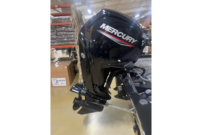 Slide: The Image of Mercury outboard motor on 2026 Tracker Pro Team 175 Crappie Edition boat in showroom. - 2