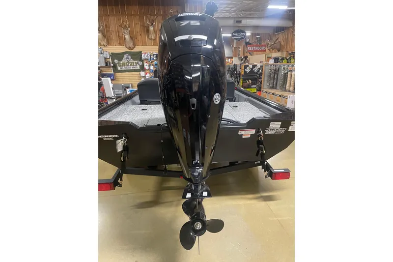 Slide: The Image of 2026 Tracker Pro Team 175 Crappie Edition boat with Mercury outboard motor in showroom. - 3