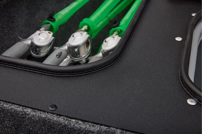 Slide: The Image of Manufacturer Provided Image: Fishing rods stored in a 2026 Tracker Pro Team 175 Crappie Edition boat compartment. - 47