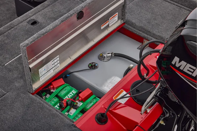 Slide: The Image of Manufacturer Provided Image: 2026 Tracker Pro Team 175 Crappie Edition boat battery compartment with engine and storage. - 64