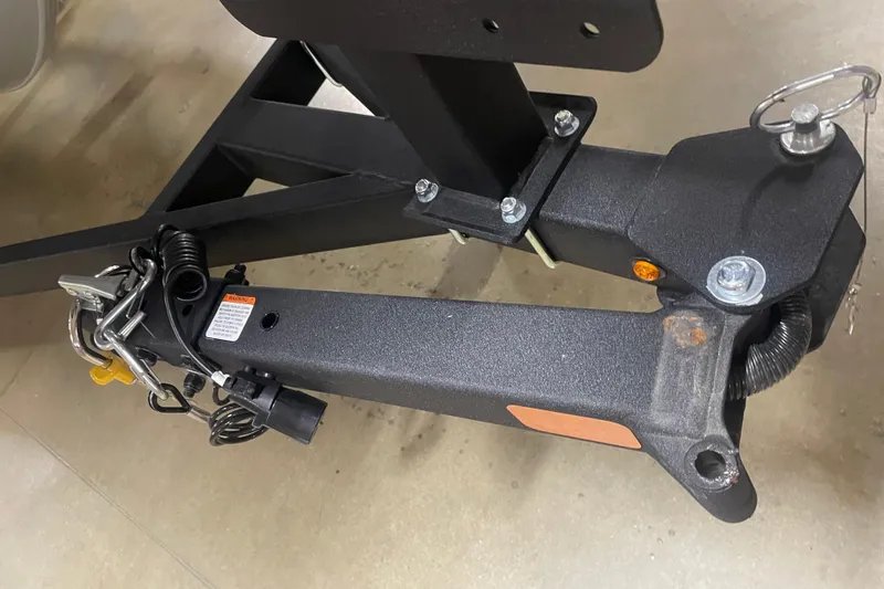 Slide: The Image of Trailer hitch of 2026 Tracker Pro Team 175 Crappie Edition boat, featuring secure locking mechanism. - 7