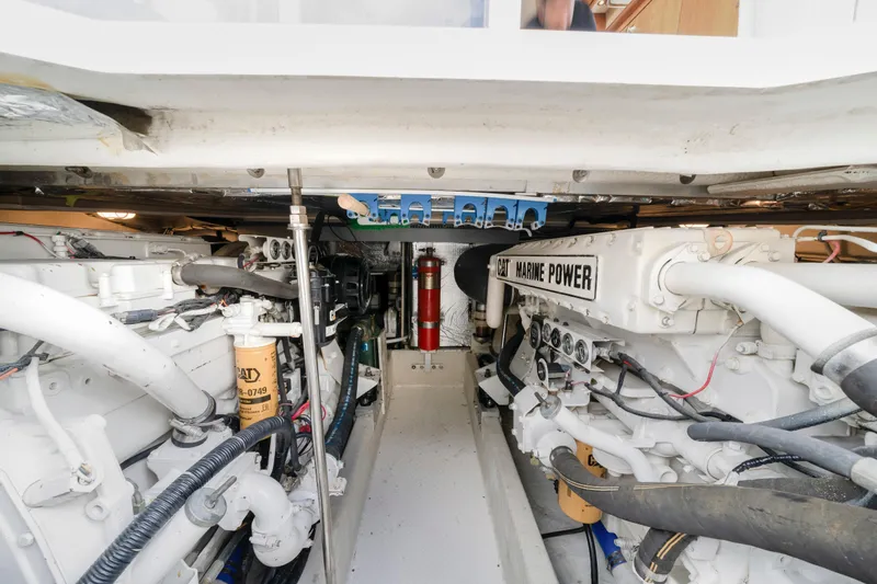 Slide: The Image of Engine room of 2001 Cruisers Yachts 5000 Sedan Sport, featuring CAT Marine Power engines. - 22