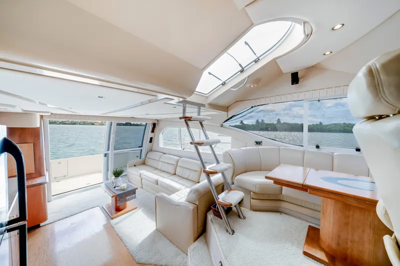 Slide: The Image of Luxurious interior of 2001 Cruisers Yachts 5000 Sedan Sport with elegant seating and panoramic windows. - 35