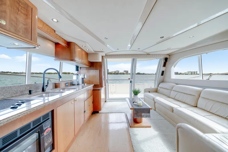 Slide: The Image of Luxurious interior of 2001 Cruisers Yachts 5000 Sedan Sport with modern kitchen and seating. - 42