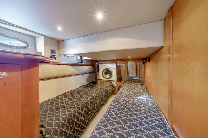 Slide: The Image of 2001 Cruisers Yachts 5000 Sedan Sport cabin with twin beds and washer. - 49