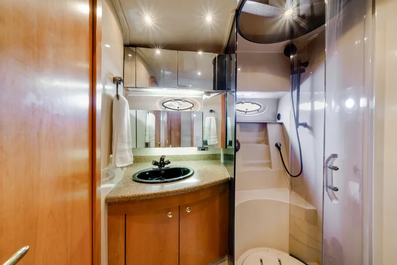 Slide: The Image of Luxurious bathroom in 2001 Cruisers Yachts 5000 Sedan Sport with modern fixtures and elegant design. - 51