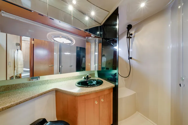 Slide: The Image of Luxurious bathroom in 2001 Cruisers Yachts 5000 Sedan Sport with modern fixtures. - 54