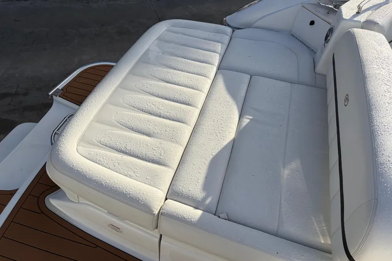 Slide: The Image of Luxurious white seating on a 2015 Cobalt 336 boat, featuring elegant design and craftsmanship. - 13
