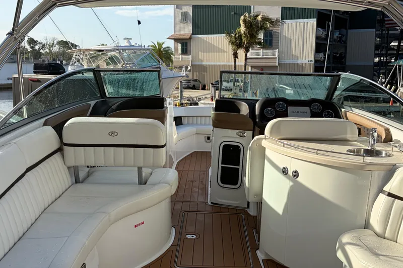 Slide: The Image of Luxurious interior of a 2015 Cobalt 336 boat with leather seating and modern dashboard. - 15