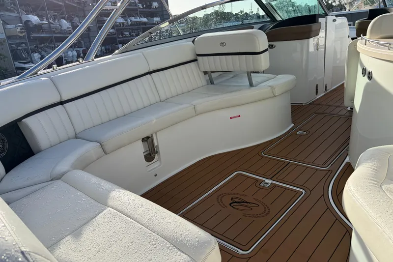 Slide: The Image of Luxurious 2015 Cobalt 336 boat interior with white seating and teak flooring. - 17