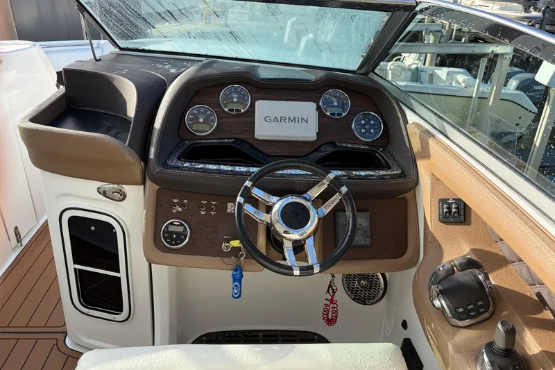 Slide: The Image of Cockpit of 2015 Cobalt 336 boat with Garmin navigation system and modern controls. - 20