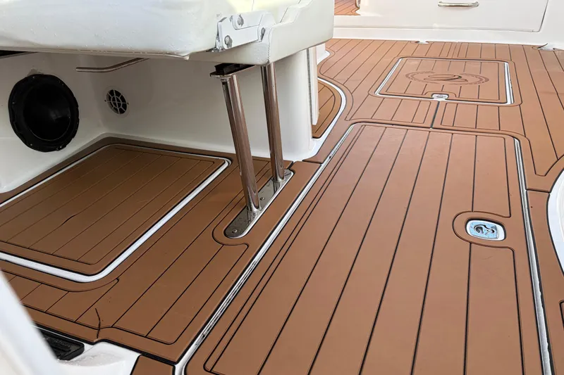 Slide: The Image of 2015 Cobalt 336 boat deck with teak-style flooring and stainless steel fittings. - 23
