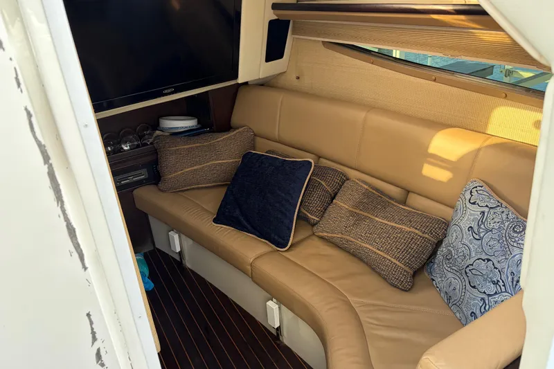 Slide: The Image of Luxurious interior of 2015 Cobalt 336 boat with plush seating and decorative pillows. - 28