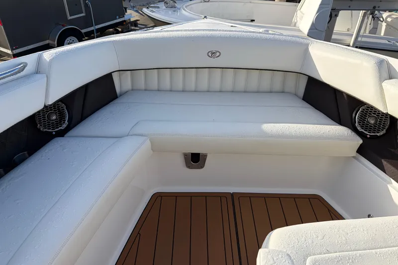 Slide: The Image of Luxurious seating area on a 2015 Cobalt 336 boat with white upholstery. - 31
