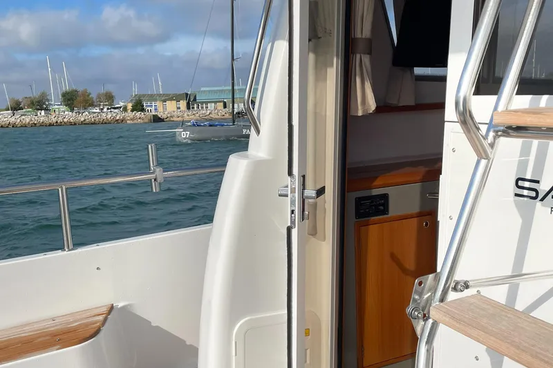 Slide: The Image of Sargo 36 Flybridge 2015 yacht interior with open door and ocean view. - 11