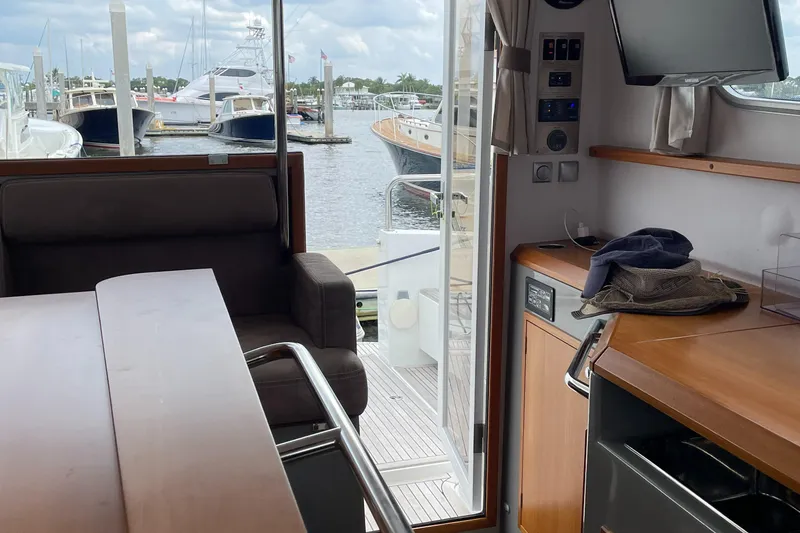 Slide: The Image of Interior view of 2015 Sargo 36 Flybridge yacht with marina in background. - 13