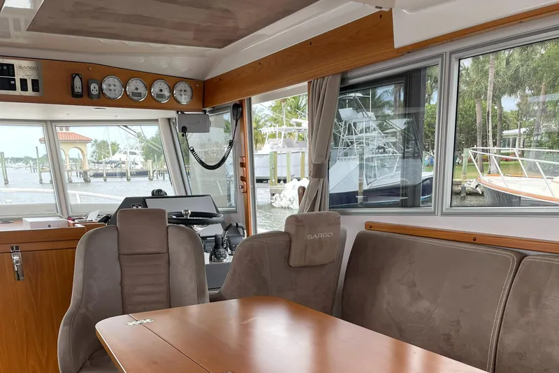 Slide: The Image of Interior of 2015 Sargo 36 Flybridge boat with seating and navigation area. - 18