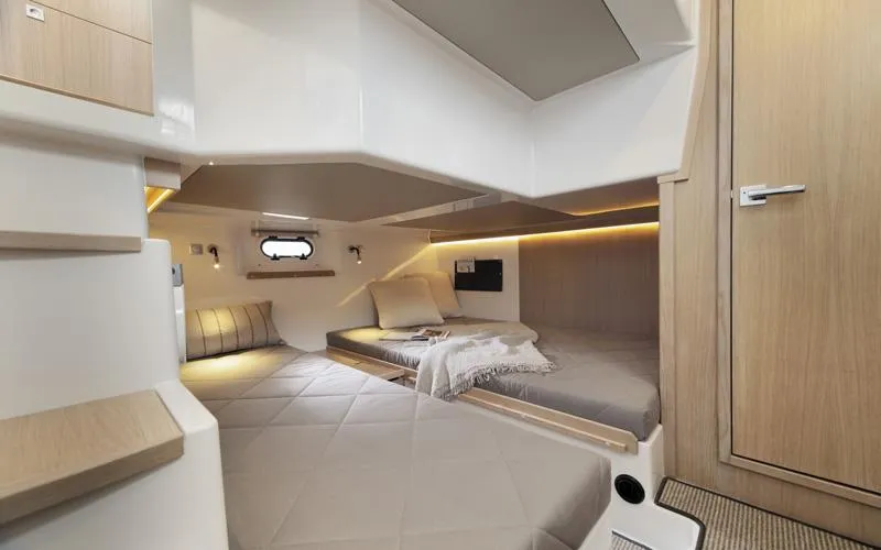 Slide: The Image of Interior of 2015 Sargo 36 Flybridge yacht, featuring cozy sleeping quarters with modern design. - 28