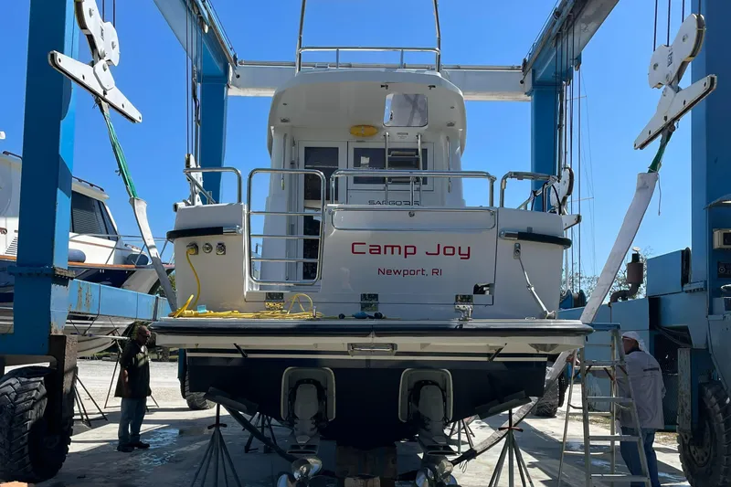 Slide: The Image of 2015 Sargo 36 Flybridge boat, "Camp Joy," in a shipyard lift, Newport, RI. - 4