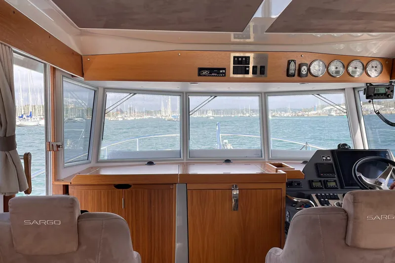 Slide: The Image of Interior view of 2015 Sargo 36 Flybridge boat cockpit with navigation instruments. - 8