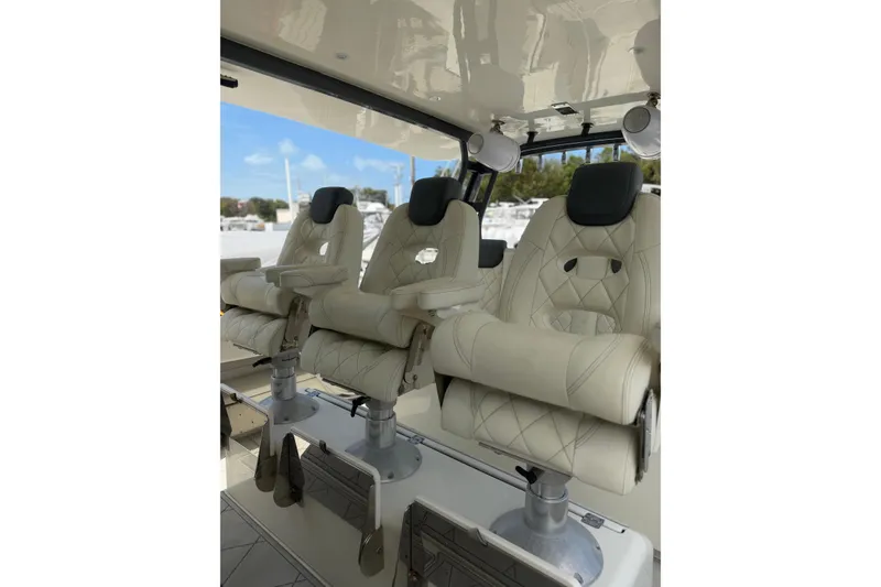 Slide: The Image of Luxurious seating on 2017 HCB 53 Suenos boat, featuring plush, diamond-stitched upholstery. - 10