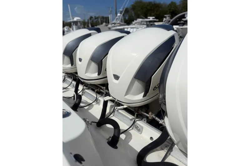 Slide: The Image of Four powerful outboard engines on a 2017 HCB 53 Suenos boat. - 11