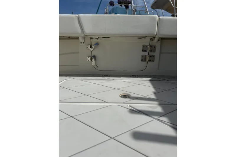 Slide: The Image of 2017 HCB 53 Suenos boat deck with white cushioned seating and stainless steel fittings. - 13