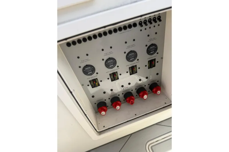 Slide: The Image of Electrical panel of a 2017 HCB 53 Suenos boat, featuring switches and gauges. - 15