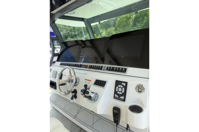 Slide: The Image of Helm of 2017 HCB 53 Suenos boat with advanced navigation displays and controls. - 20