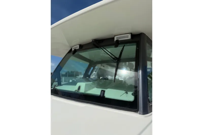 Slide: The Image of Close-up of 2017 HCB 53 Suenos boat windshield with wipers under a clear sky. - 23