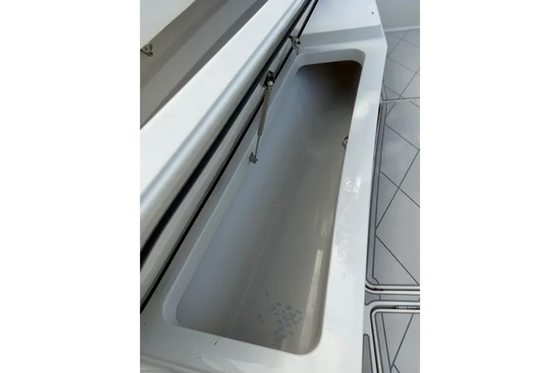 Slide: The Image of Open storage compartment on 2017 HCB 53 Suenos boat deck. - 25