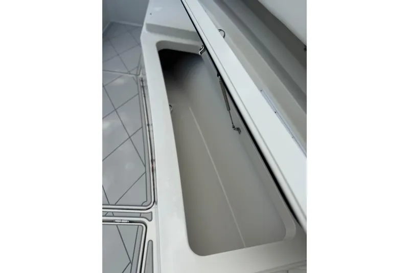 Slide: The Image of Open storage compartment on 2017 HCB 53 Suenos boat, showcasing interior space. - 26