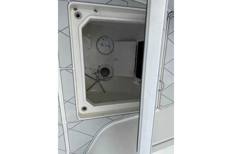 Slide: The Image of Open storage compartment on a 2017 HCB 53 Suenos boat deck. - 33
