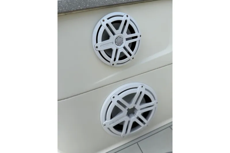 Slide: The Image of Speakers on a 2017 HCB 53 Suenos boat, featuring a sleek white design. - 34
