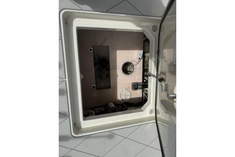 Slide: The Image of Open hatch of 2017 HCB 53 Suenos boat, showing internal compartment and wiring. - 36