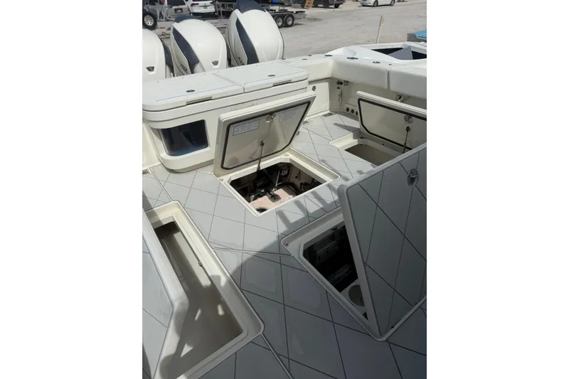Slide: The Image of Open storage compartments on a 2017 HCB 53 Suenos boat deck. - 39
