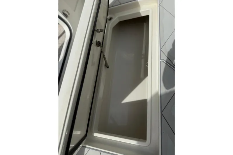 Slide: The Image of Open storage compartment on 2017 HCB 53 Suenos boat deck. - 40