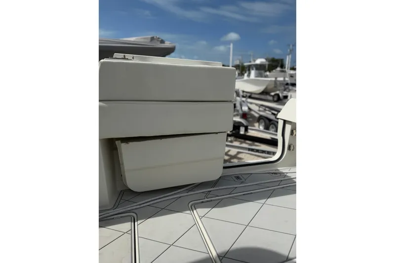 Slide: The Image of 2017 HCB 53 Suenos boat detail with sleek white design and marina background. - 41