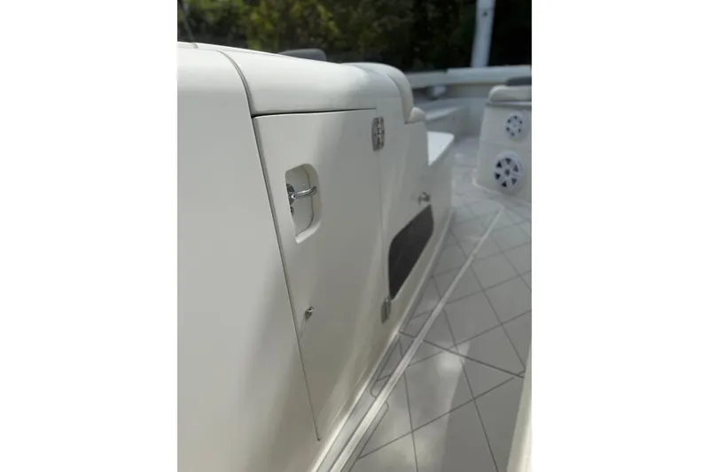 Slide: The Image of 2017 HCB 53 Suenos boat interior, featuring sleek white cabinetry and modern design elements. - 43