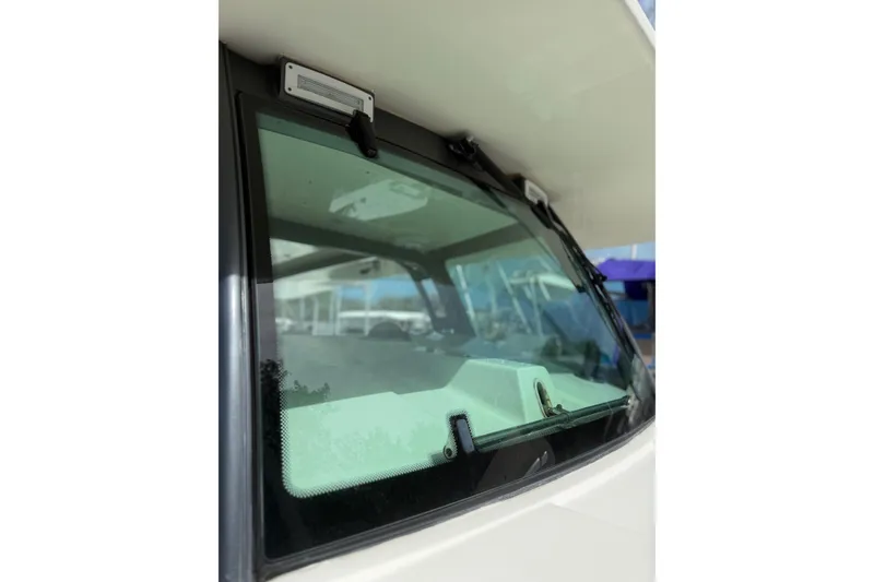Slide: The Image of Close-up of 2017 HCB 53 Suenos boat windshield, showcasing sleek design and modern features. - 44
