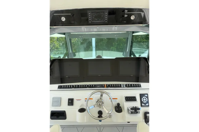 Slide: The Image of Helm of 2017 HCB 53 Suenos boat with advanced navigation displays and controls. - 7