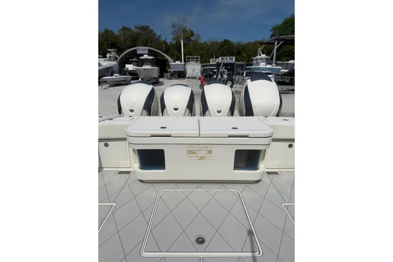 Slide: The Image of 2017 HCB 53 Suenos boat with four powerful outboard engines docked. - 9