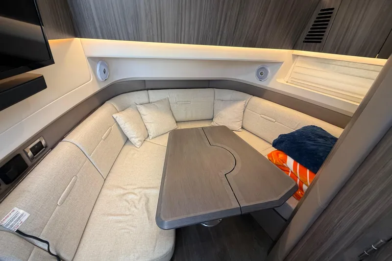 Slide: The Image of Luxurious 2022 Sea Ray SLX 400 cabin interior with cozy seating and modern design. - 47