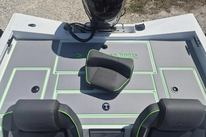 Slide: The Image of 2026 Xpress H18 boat interior with gray and green seating and deck design. - 4