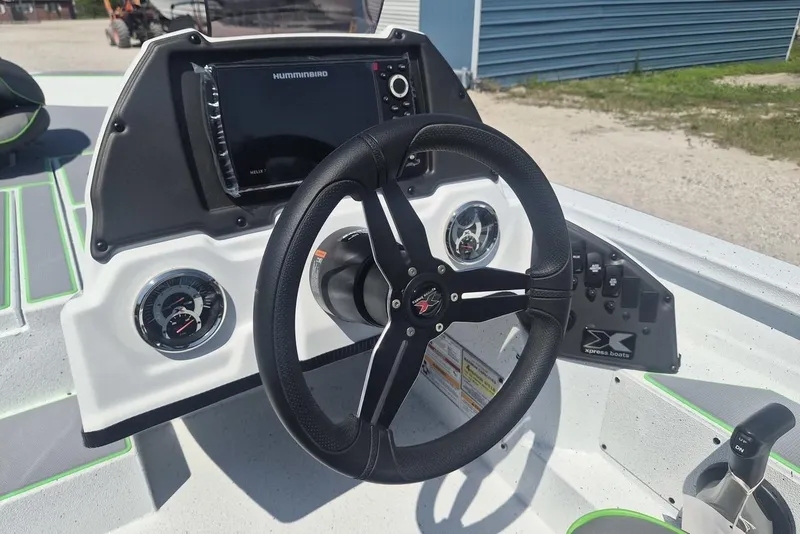 Slide: The Image of Steering console of 2026 Xpress H18 boat with gauges and navigation system. - 6