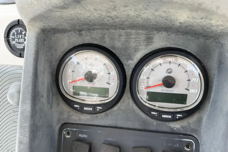 Slide: The Image of Dashboard of a 2009 Boston Whaler 230 Dauntless with RPM and speed gauges. - 10
