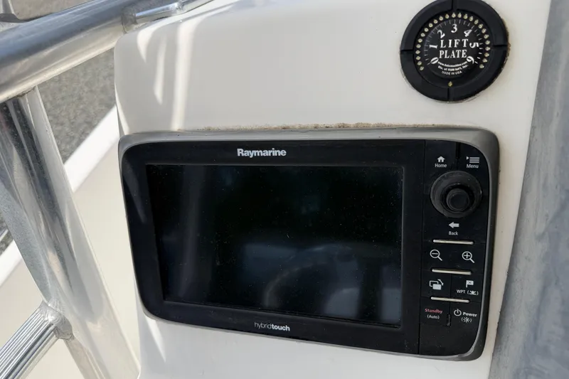 Slide: The Image of Raymarine display on 2009 Boston Whaler 230 Dauntless boat dashboard. - 11