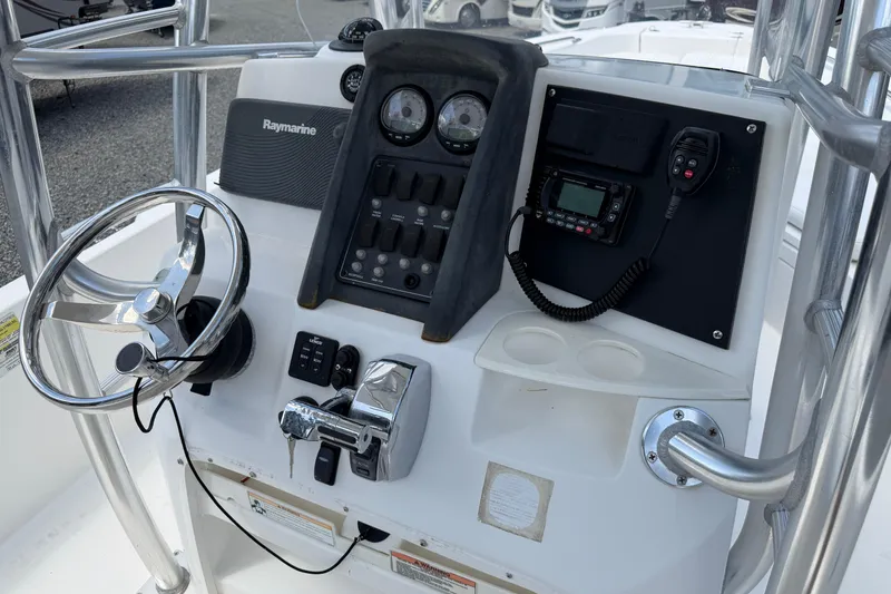 Slide: The Image of 2009 Boston Whaler 230 Dauntless helm with Raymarine electronics and steering wheel. - 8