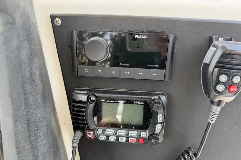 Slide: The Image of Control panel of a 2009 Boston Whaler 230 Dauntless with radio and audio system. - 9