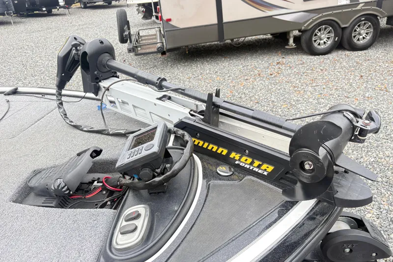 Slide: The Image of 2013 Nitro Z-7 boat with Minn Kota Fortrex trolling motor on gravel surface. - 10